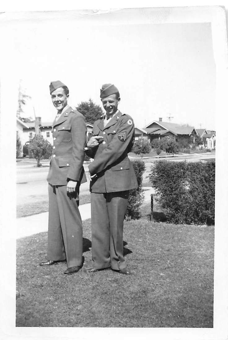 Two soldiers on residential lawn
