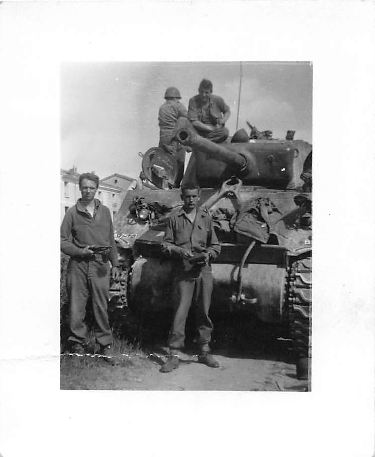 Sherman tank with soldiers in Italy