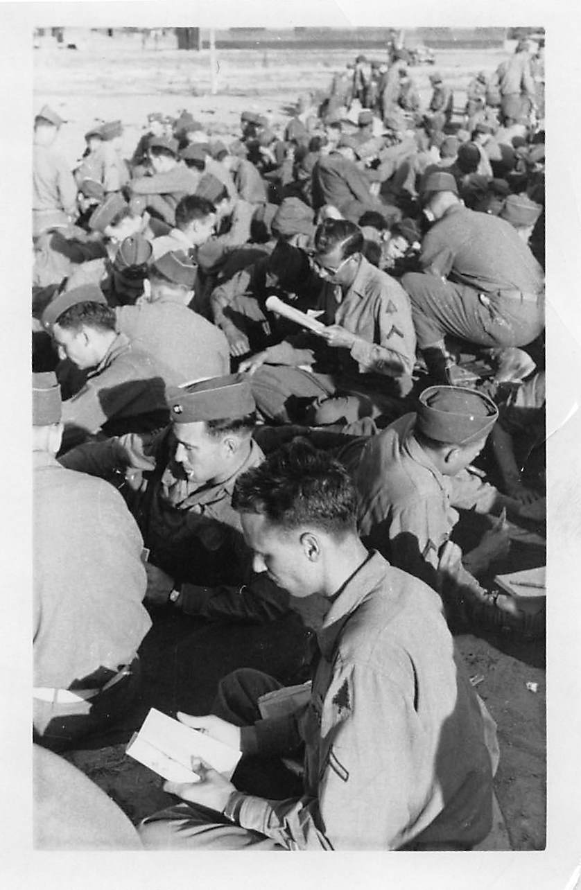 Hundreds of soldiers reading documents