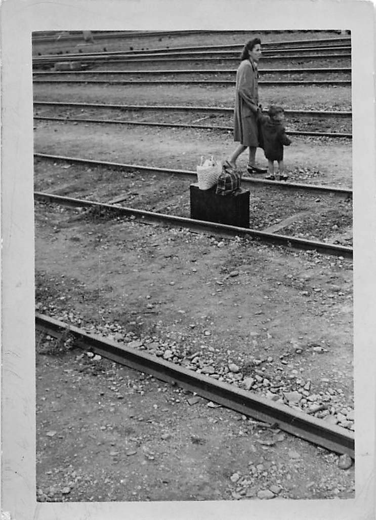 Italian woman and child crossing railroad tracks